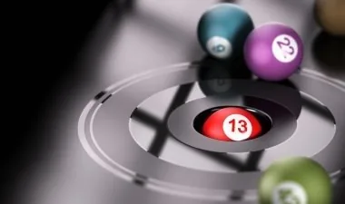 Numbered balls with a red ball on a target ring